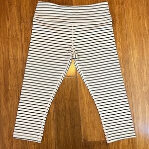 Scorpio Sol cropped leggings, size small, white with thin black stripes